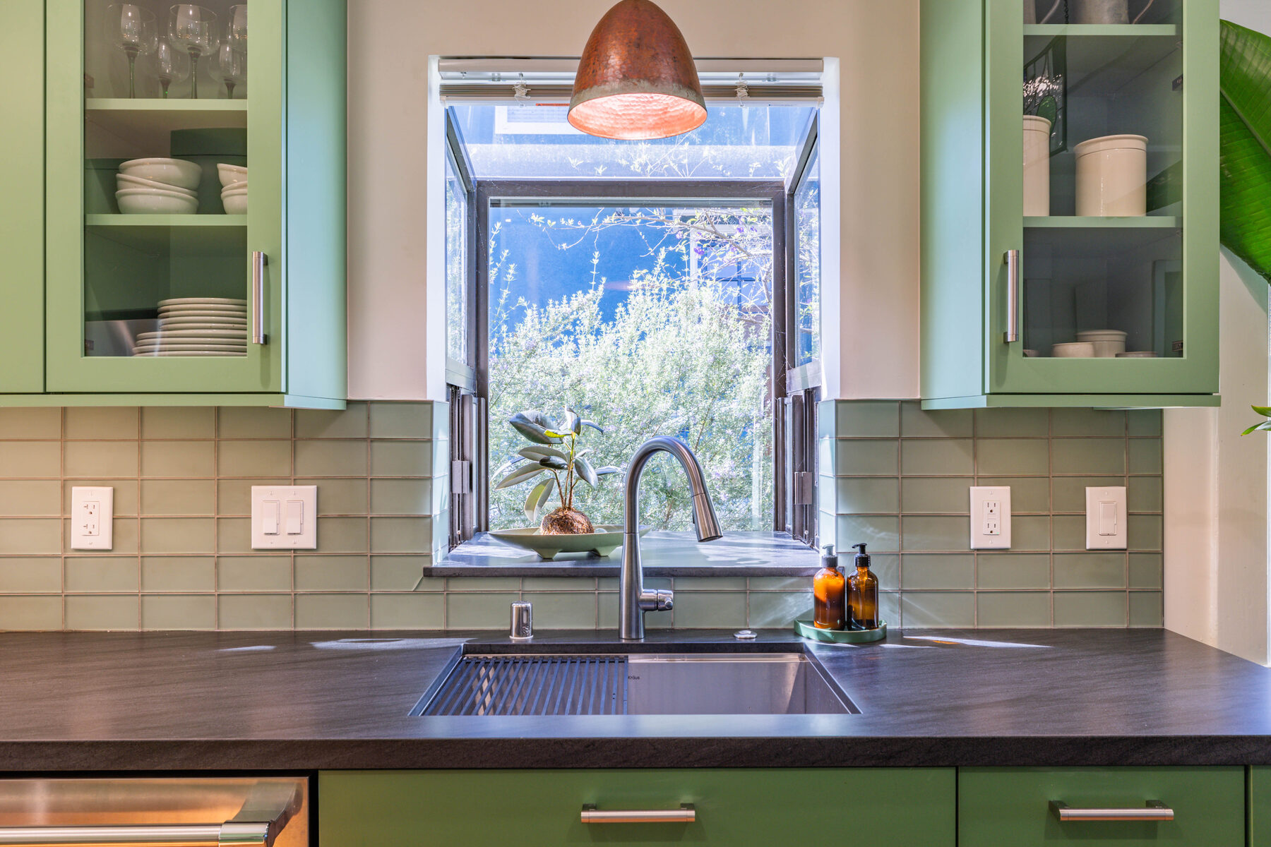 Sink with garden box window and hammered copper pendant