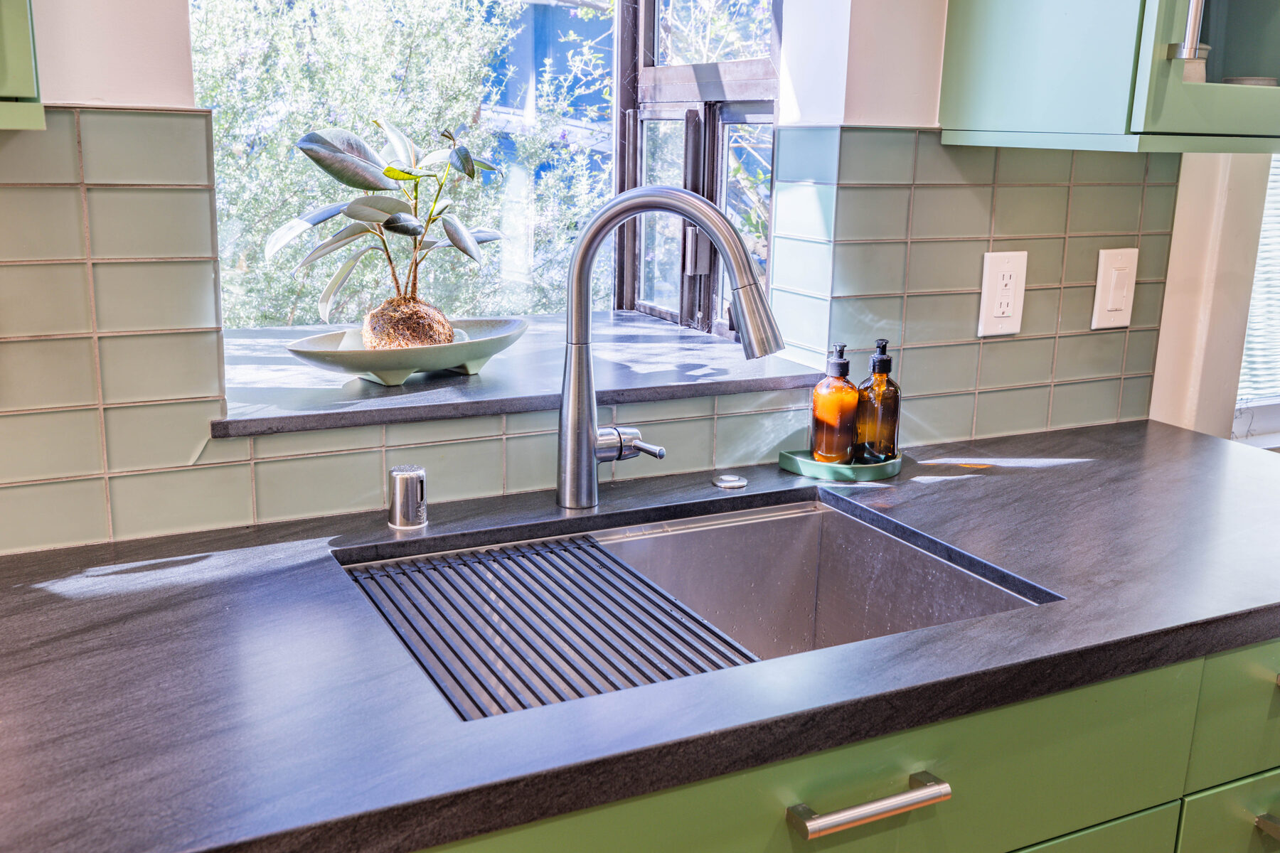 Sink detail with garden box and rubber plant