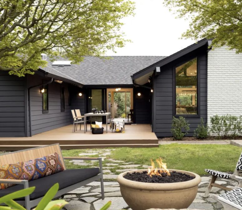 Backyard deck and stone terrace with fire-pit lounge