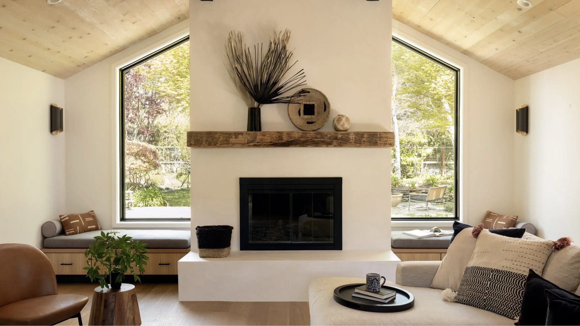 Living room with plaster fireplace and reclaimed timber mantel