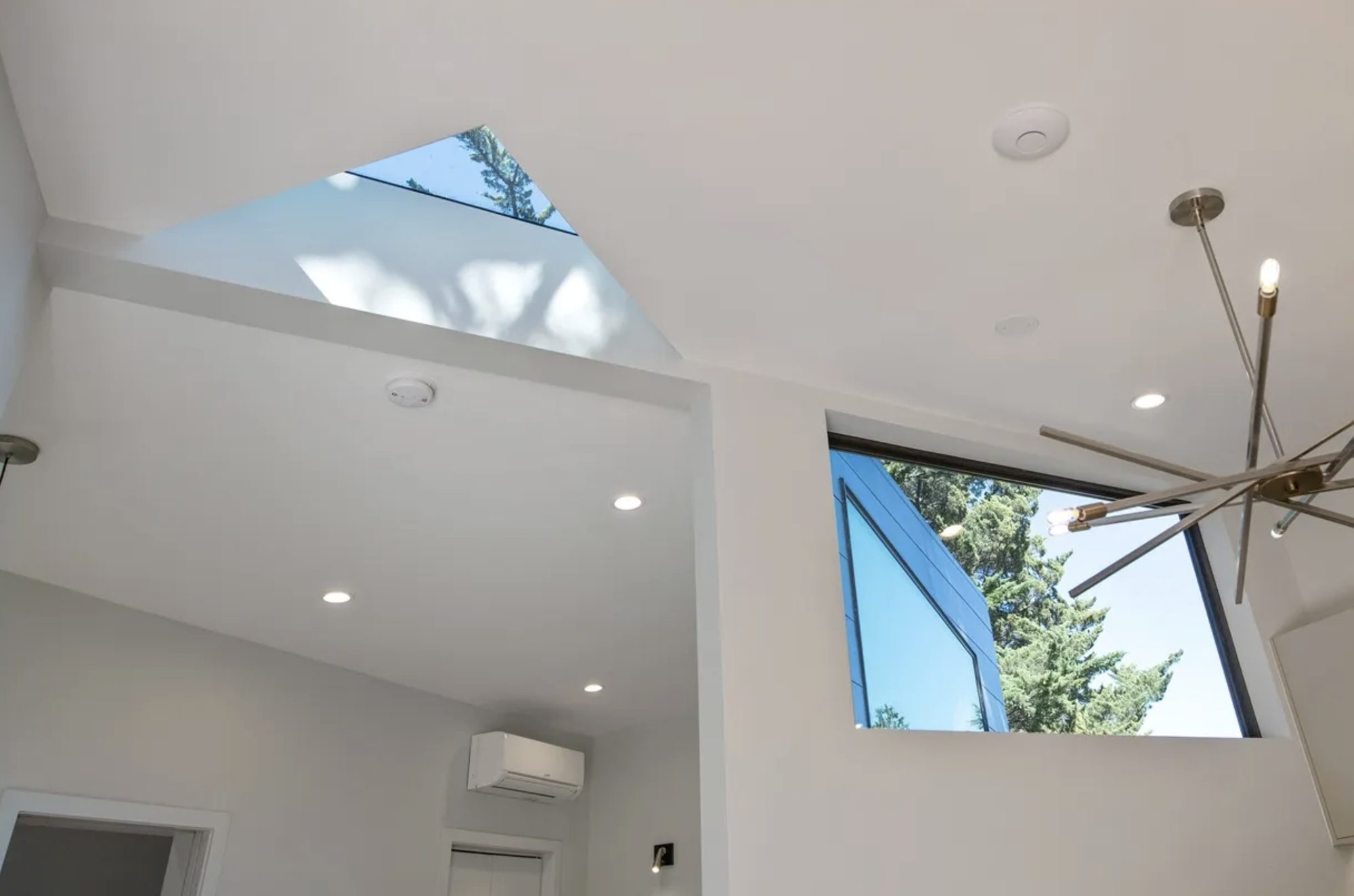 Vaulted ceiling with triangular skylight and angled clerestory