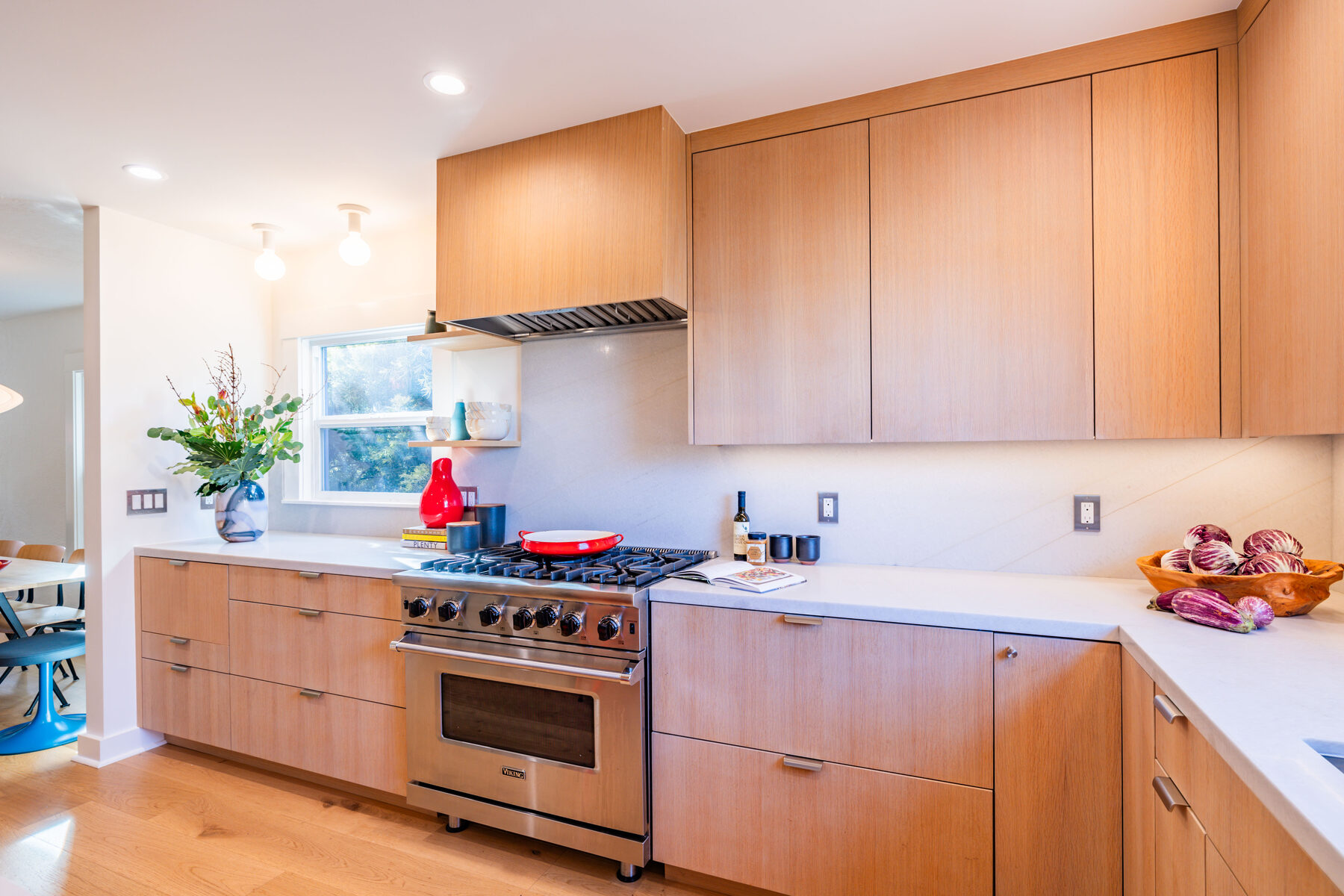 Kitchen view with Viking range and quartz backsplash