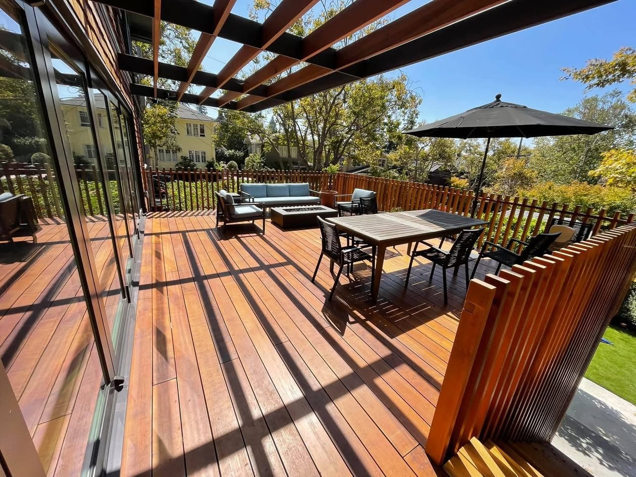 Skyline Deck — elevated ipe deck with pergola and slatted redwood privacy screens